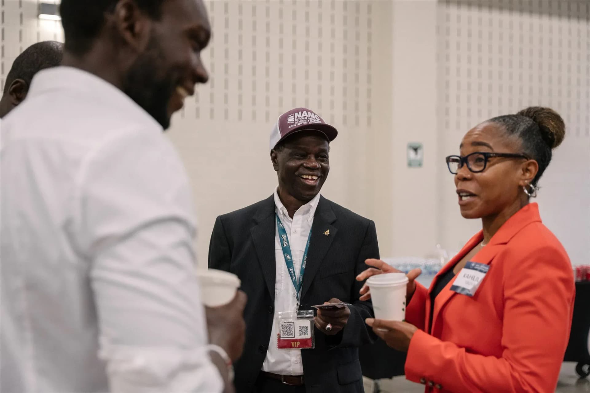 Corporate event guests talking during a reception