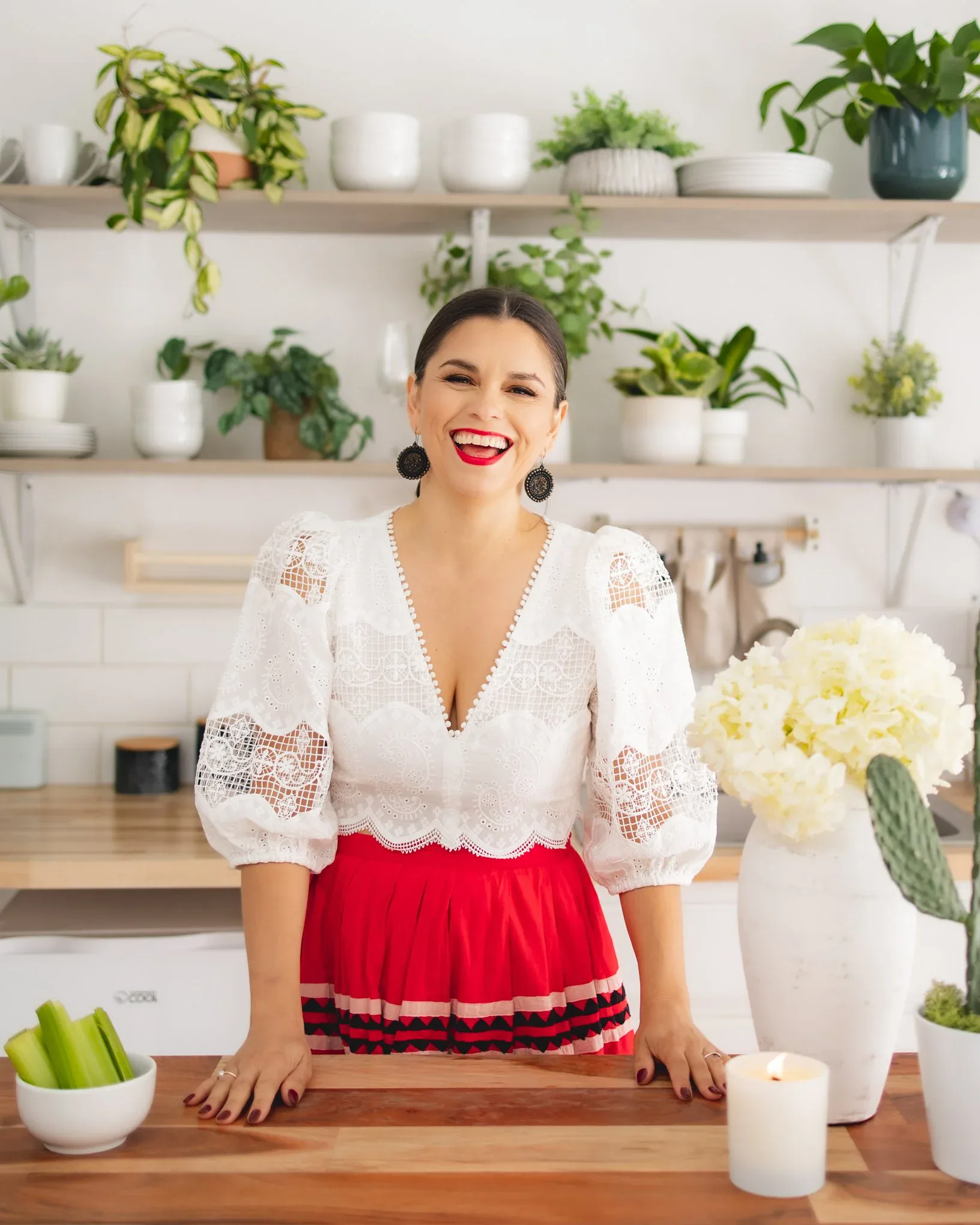 Smiling founder portrait in a bright studio kitchen