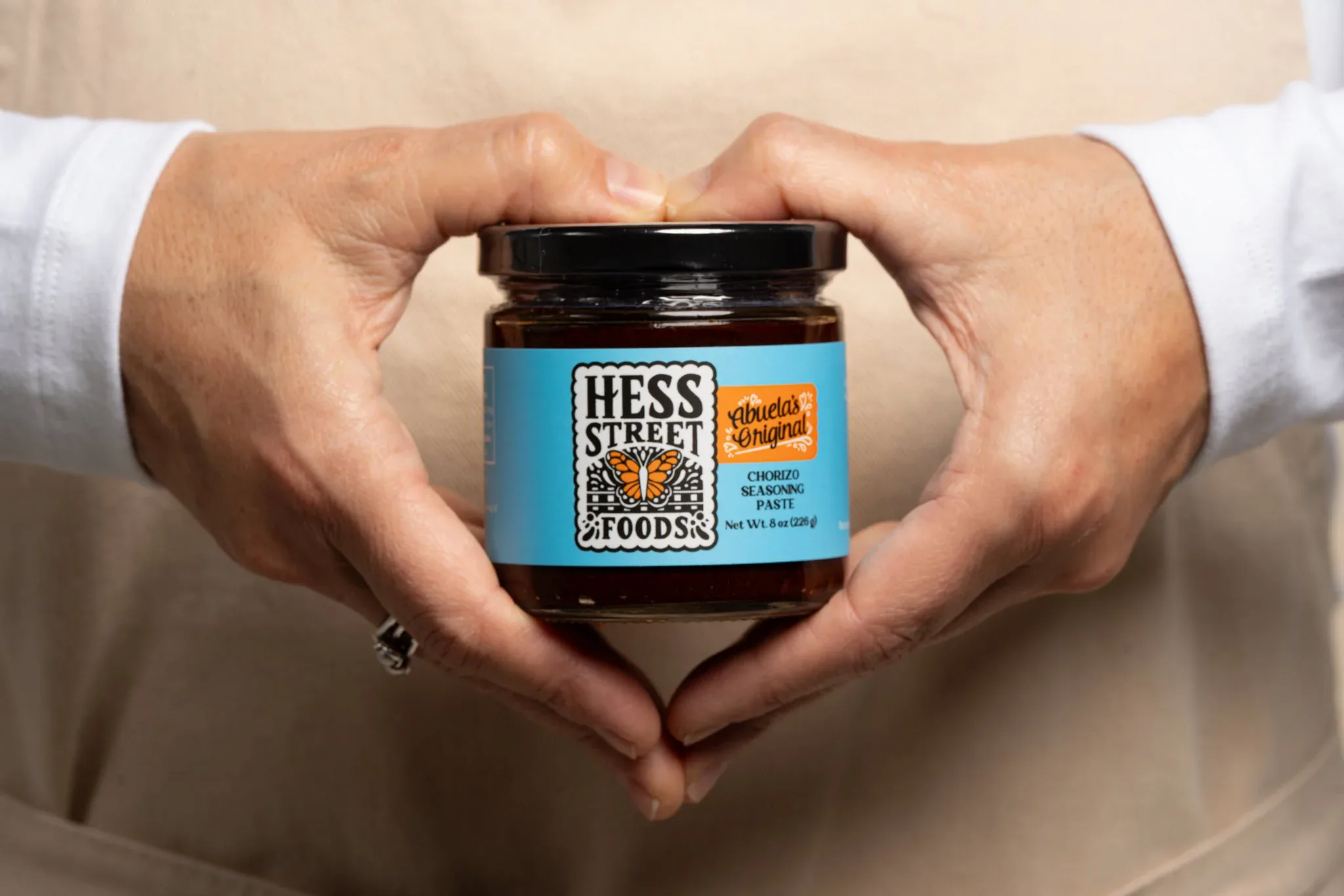 Hands holding a packaged food product for campaign photography